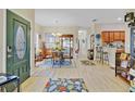 Open-concept foyer with dining area, wood floors, and inviting atmosphere at 3640 Solana Cir # A, Clermont, FL 34711