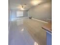 Bright and airy living room with tile floors, neutral walls and ceiling fan at 3719 Madbury Cir, Lakeland, FL 33810