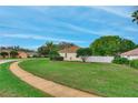 Spacious front yard featuring a lush lawn and mature trees at 460 Quail Hill Dr, Debary, FL 32713