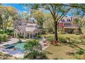 Stunning aerial view of a luxury home showcasing a beautiful pool and lush landscaping at 721 Delaney Ave, Orlando, FL 32801