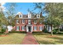 Charming brick home with well-manicured lawn and classic architectural details at 721 Delaney Ave, Orlando, FL 32801