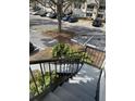 View of the condo's parking area from the top of the concrete staircase at 1055 S Hiawassee Rd # 2027, Orlando, FL 32835