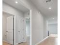 Bright hallway featuring neutral paint and tile flooring at 1630 Laia Rd, Haines City, FL 33844