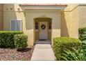 Inviting front entrance with decorative wreath and well-maintained landscaping at 3133 Yellow Lantana Ln, Kissimmee, FL 34747