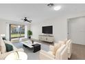 This well-appointed living room features neutral tones, contemporary furnishings, and plenty of natural light at 3960 Southpointe Dr # 509, Orlando, FL 32822