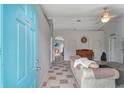 Bright foyer with tile flooring, and a glimpse into the living area, with a piano at 647 Holbrook Ave, Deltona, FL 32738