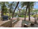 Serene backyard with a grill, hammock, mature trees and views of a pond and fountain at 940 Douglas Ave # 189, Altamonte Springs, FL 32714