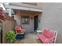 Cozy front porch with a swing, bench, potted plants, and a decorated front door at 940 Douglas Ave # 189, Altamonte Springs, FL 32714