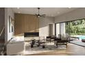 Bright living room boasts a modern fireplace and light hardwood floors with sliding doors to the pool at 1702 Arbor Park Dr, Winter Park, FL 32789