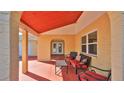 Inviting covered front porch with comfortable seating for relaxing outdoors at 209 Georgetowne Blvd, Daytona Beach, FL 32119