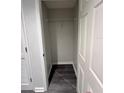 Open, empty closet with dark gray wood floors in a condo or apartment at 322 E Central Blvd # 1805, Orlando, FL 32801