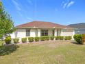 Inviting single-story home with lush green lawn and trimmed landscaping at 5361 Se 92Nd St, Ocala, FL 34480