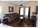 Bright living room with vaulted ceiling, a comfortable sectional sofa, and large windows for natural light at 7508 Covedale Dr, Orlando, FL 32818