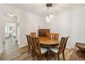 Cozy dining room featuring an elegant table, pendant lighting, and ample space at 9686 Cypress Pine St, Orlando, FL 32827