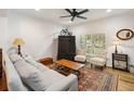 Inviting living room showcasing a comfortable sofa, vintage accents, and natural light at 9686 Cypress Pine St, Orlando, FL 32827