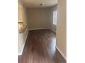 A sunlit living room with wood floors and neutral-colored walls at 9916 Sweepstakes Ln # 1, Orlando, FL 32837