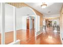 Bright and airy living space with hardwood floors and decorative columns at 1321 Medinah Ct, Winter Park, FL 32792