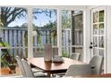 Bright dining area with large windows overlooking back yard at 178 W Sabal Palm Pl # 178, Longwood, FL 32779