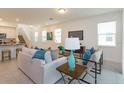 Spacious living room featuring abundant natural light and neutral colors at 2472 Firstlight Way, Winter Park, FL 32792