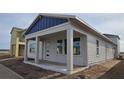 Charming one-story home featuring large windows and a welcoming front porch at 2953 Sailhouse Dr, St Cloud, FL 34771