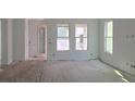 Bright living room featuring white walls and multiple windows for ample natural light at 2953 Sailhouse Dr, St Cloud, FL 34771