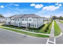 Street view showcasing townhouses with well-maintained lawns at 3270 Water Sprite St, Orlando, FL 32808