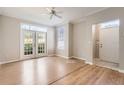 Bright living room boasts French doors and a large window allowing natural light at 6340 Raleigh St # 1002, Orlando, FL 32835