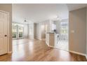 Open floor plan integrates living area with a view of the modern kitchen space at 6340 Raleigh St # 1002, Orlando, FL 32835