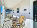 Relaxing front porch features rocking chairs, creating a cozy and inviting outdoor space at 6404 Pine Fork Aly, St Cloud, FL 34771