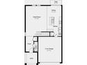 Open floor plan showing the layout of the first floor, including kitchen, living spaces, and garage at 7351 Capstone Dr, Groveland, FL 34736