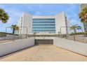 Exterior of The Atrium building showing the entrance and architectural details at 901 S Atlantic Ave # 208, Ormond Beach, FL 32176
