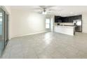 Spacious living room area with tile floors, open layout and natural light at 2015 Sloans Outlook Dr, Groveland, FL 34736