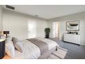 Cozy main bedroom featuring neutral walls, plush carpet, and a dresser at 2015 Sloans Outlook Dr, Groveland, FL 34736