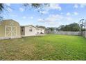 Expansive backyard featuring a storage shed and plenty of space for outdoor activities at 2260 Danforth Ave, Deltona, FL 32738