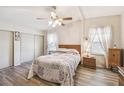 Cozy bedroom featuring a comfortable bed, ceiling fan, and closet at 2706 Cranmoor Dr, Kissimmee, FL 34758