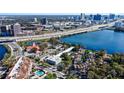 Aerial view showcasing the property's waterfront, nearby interstate, and cityscape views at 320 Lakeview St # 316, Orlando, FL 32804