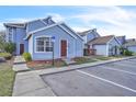 Inviting light blue townhouse featuring well-kept landscaping and designated parking at 758 Orchid Dr, Davenport, FL 33897