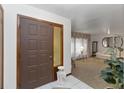 View of the entrance featuring tile floors, a decorative table and an open view of the living area at 8128 Hook Cir, Orlando, FL 32836