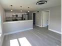 Inviting living room showcasing a modern open concept with an eat-in kitchen at 1200 Jarecki Ave, Holly Hill, FL 32117
