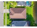 Birds eye view of the roof and lawn with views of the lake at 1401 Royal Saint George Dr, Orlando, FL 32828