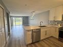 Bright, updated kitchen with modern appliances, stylish backsplash, and open layout at 14025 Fairway Island Dr # S, Orlando, FL 32837
