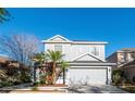 Charming two-story home featuring a well-manicured lawn and an attached two-car garage at 14415 Estrella Dr, Orlando, FL 32837
