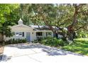Charming single-story home with mature trees and a well-manicured lawn at 1721 Cheyenne Trl, Maitland, FL 32751