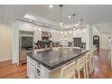 A chef's kitchen with a large island, stainless steel appliances, and an open design creates an inviting space at 1731 Windsor Dr, Winter Park, FL 32789