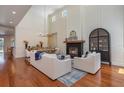 The spacious living room is highlighted by a fireplace, vaulted ceilings, and natural light from abundant windows at 1731 Windsor Dr, Winter Park, FL 32789