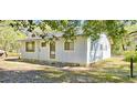Exterior view of cozy home with newly added skirting at 20660 Se 155Th St, Umatilla, FL 32784