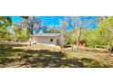 Back view of home and lot showcasing ample outdoor space at 20660 Se 155Th St, Umatilla, FL 32784