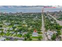 An aerial view of a charming home close to the beach with luscious green landscaping at 350 E 2Nd Ave, New Smyrna Beach, FL 32169