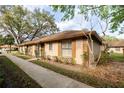 Single-story home featuring tidy landscaping, a sidewalk, and neutral-tone exterior paint at 385 Eron Way # 45, Winter Garden, FL 34787