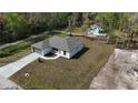 An aerial view of a single-Gathering home with a large yard in a peaceful, wooded neighborhood at 4470 Frances Ave, Sanford, FL 32773